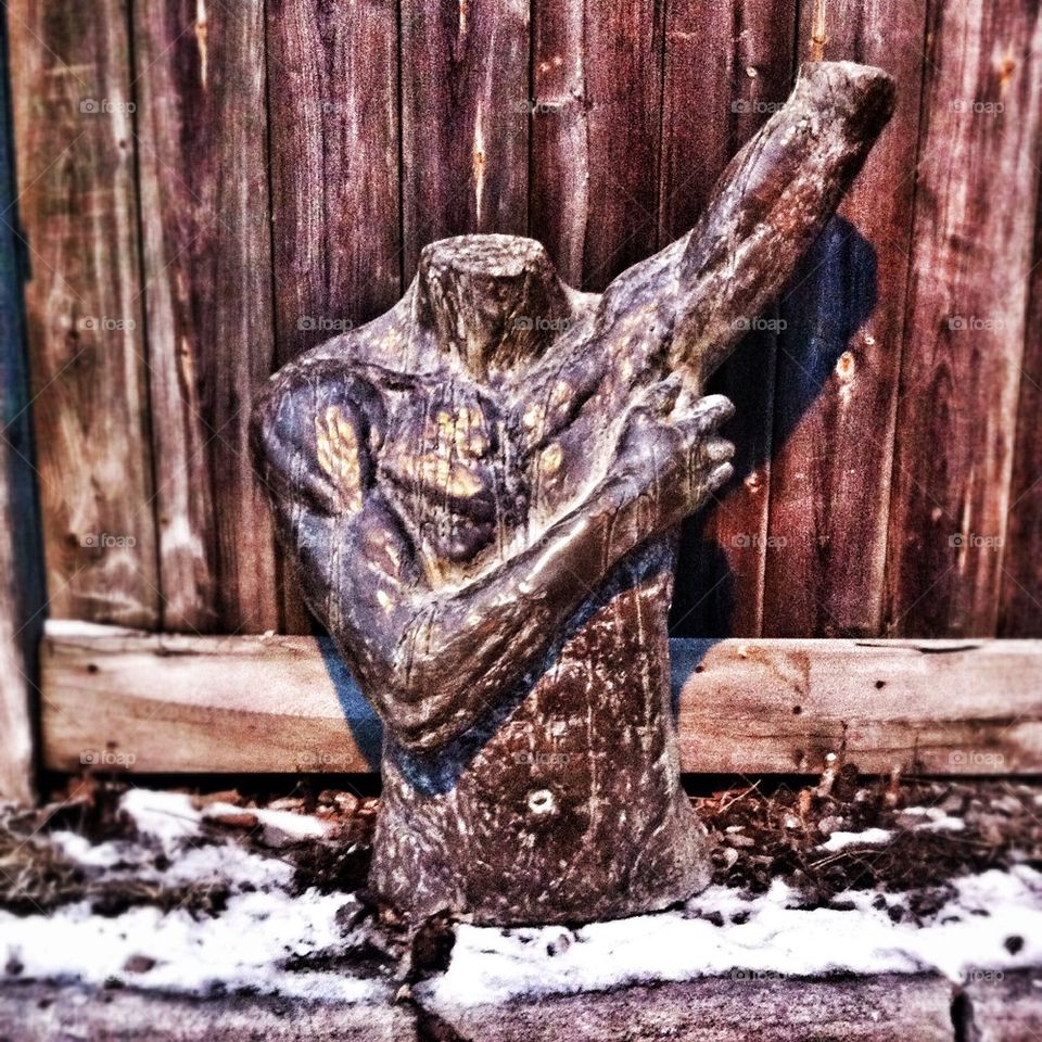 Male bust in the trash