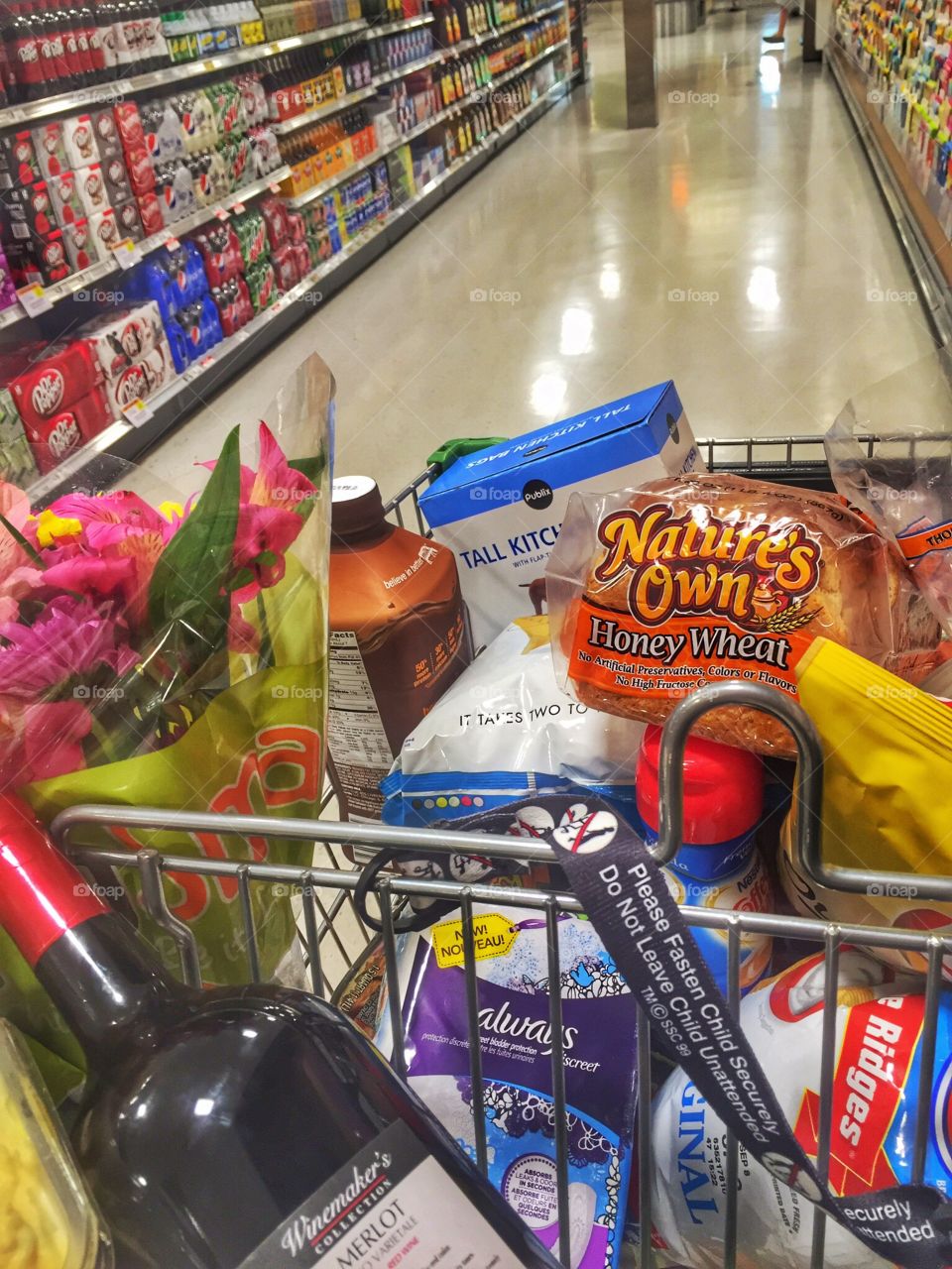 Grocery Shopping. A cart full of groceries