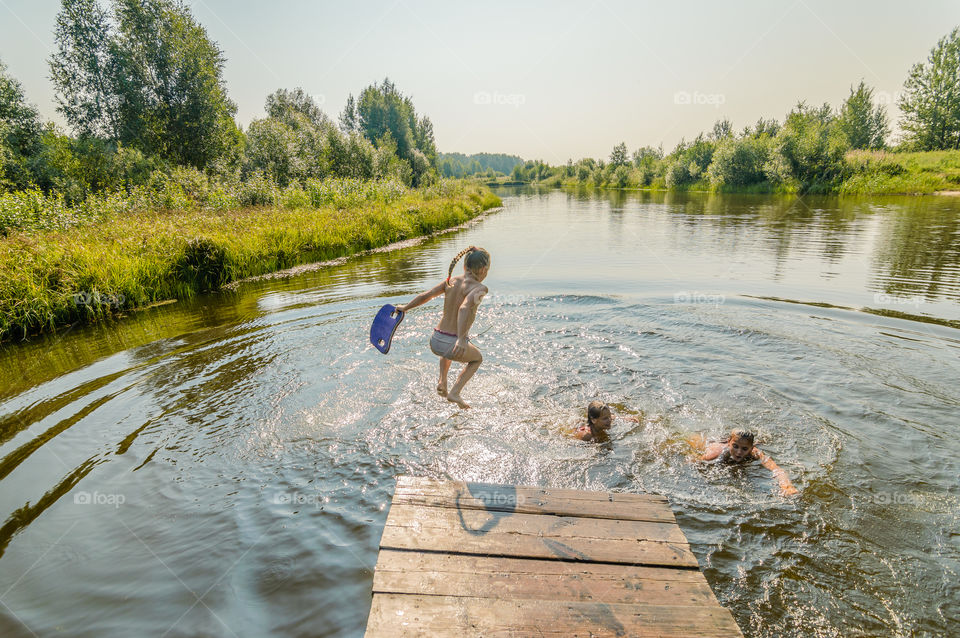 Jumping in the water, kids swimming