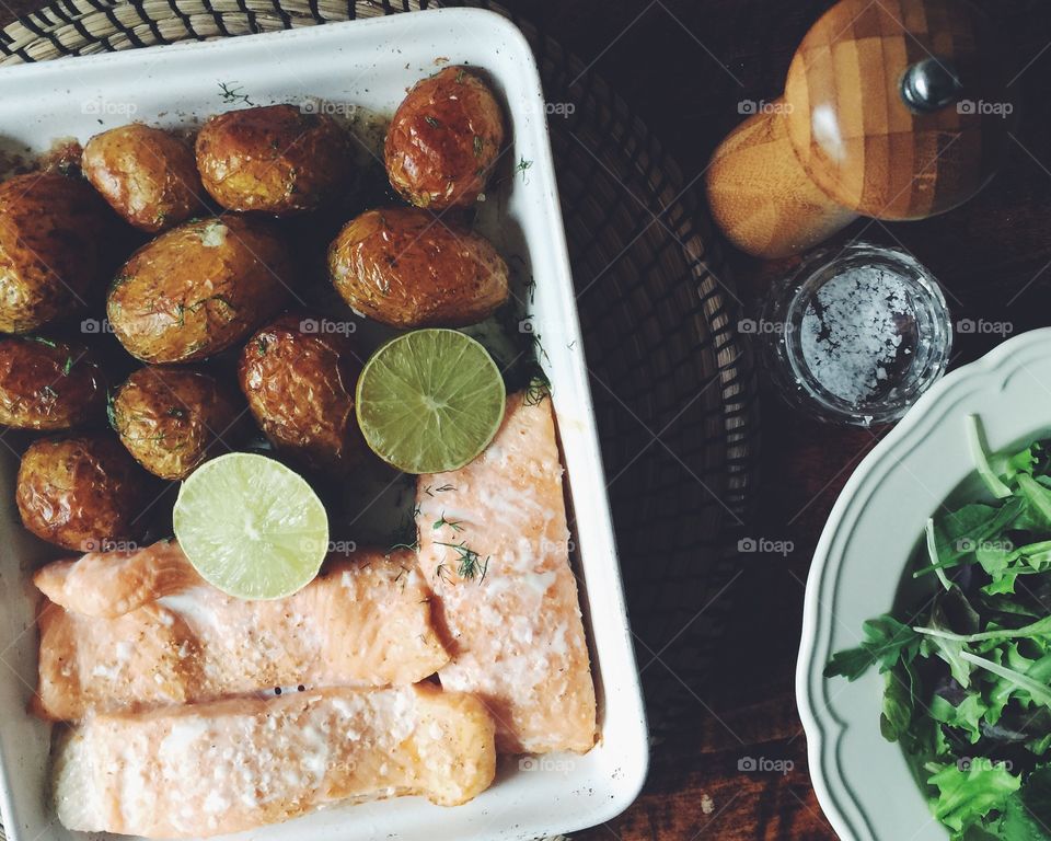 High angle view of a salmon and oven potatoes