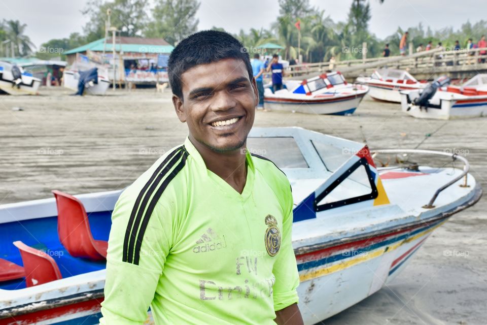 A neutral innocent smile by a day labourer who lead his life with much more struggle each and every day, moreover this happiness costs priceless ! Thank You :) 