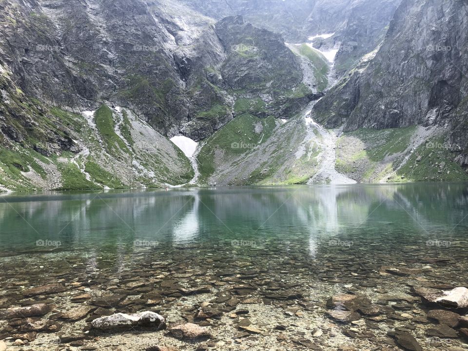 Beautiful lake in Poland with snow melting.