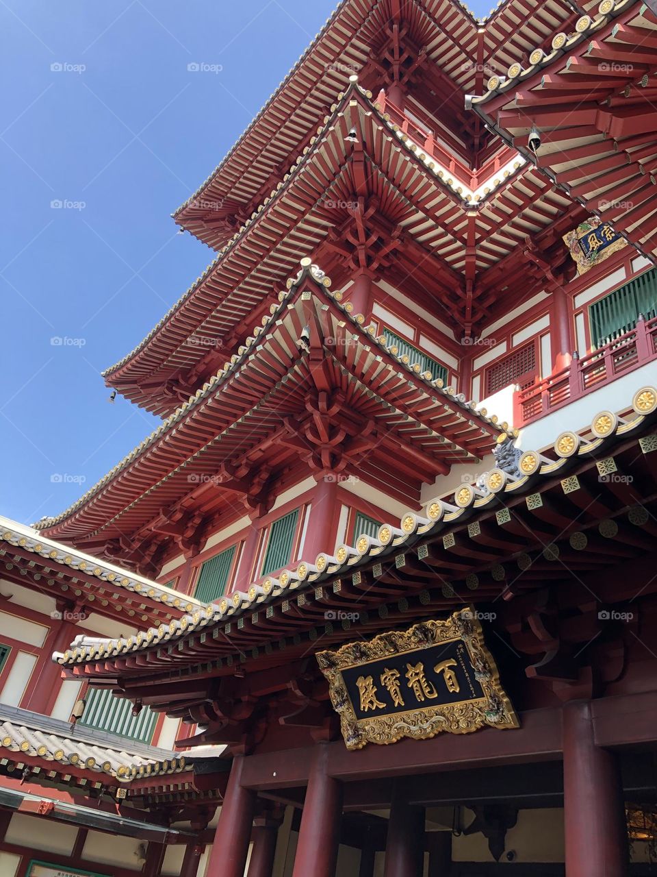 Buddhist temple facade view in red and green