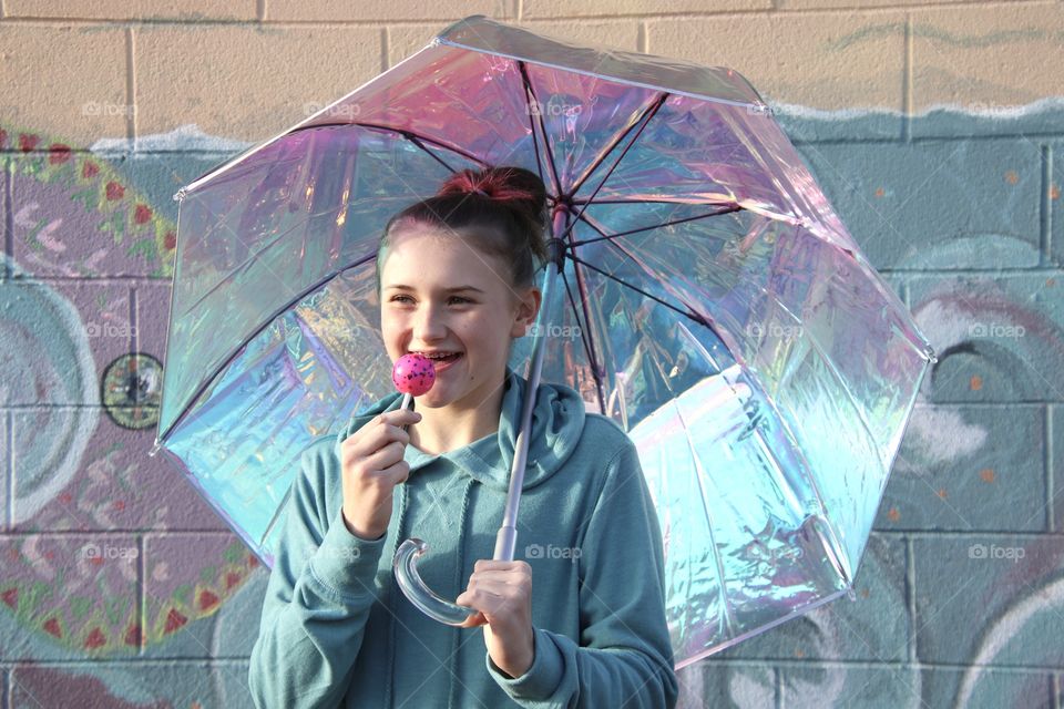 Girl holding Iridescent umbrella