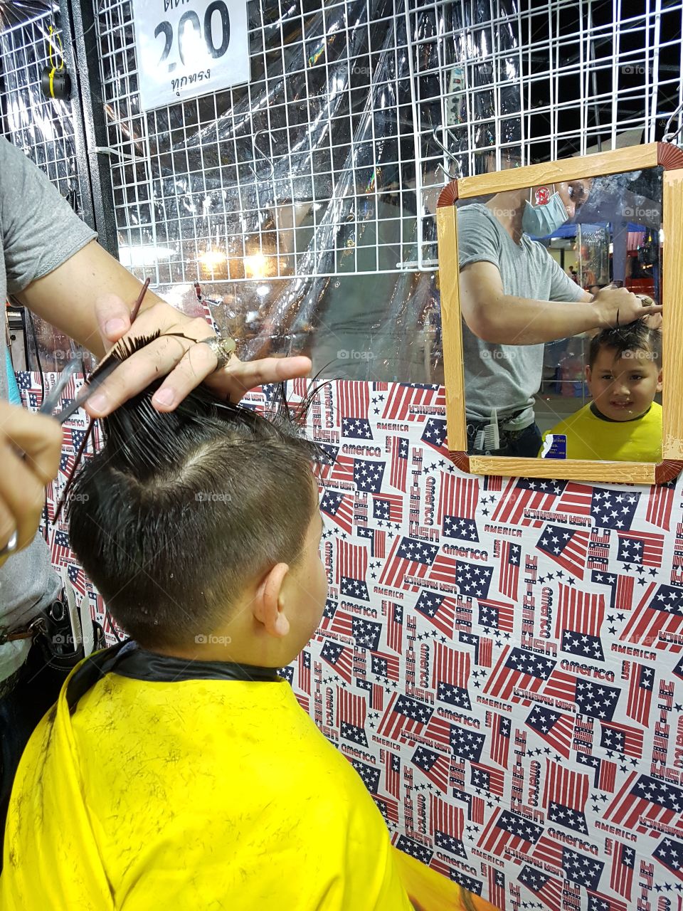 young boy getting a hair cut