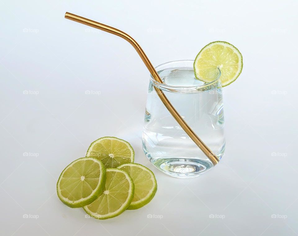 A glass of pure drinking water with a metal reusable straw and lime💧🍋Healthy lifestyle💧💧