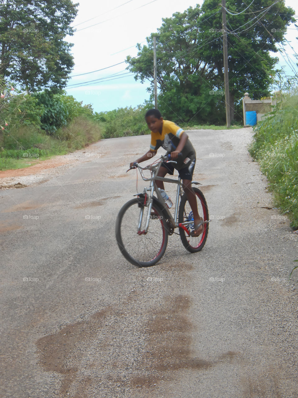 Boy Riding On Road