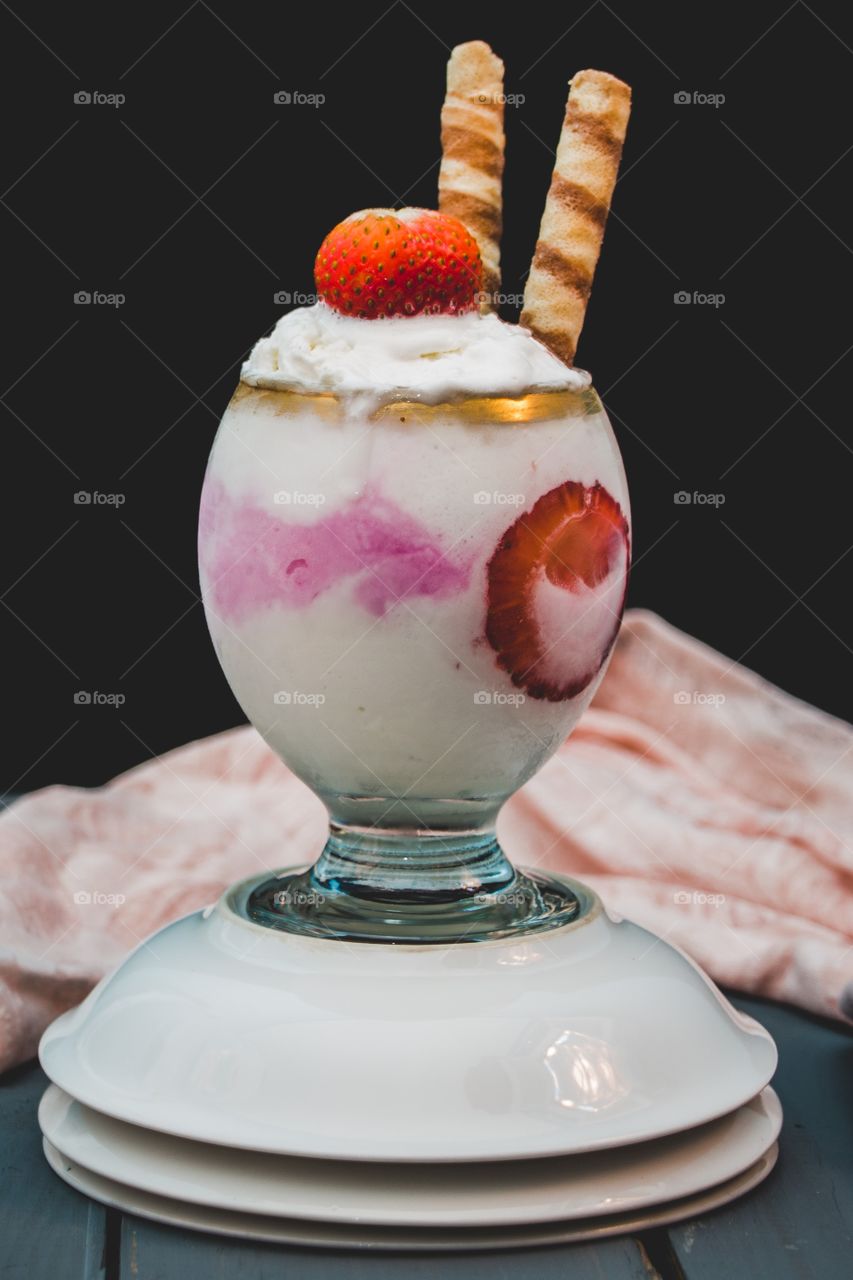 Vanilla and Strawberry Ice Cream with strawberry pieces and chocolate biscuits