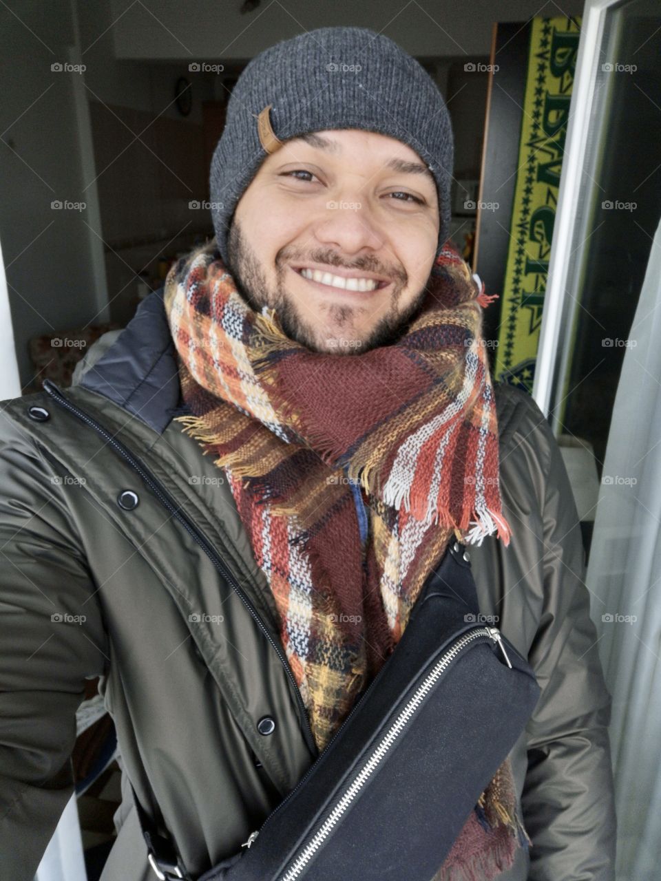 Man smiling despite the cold