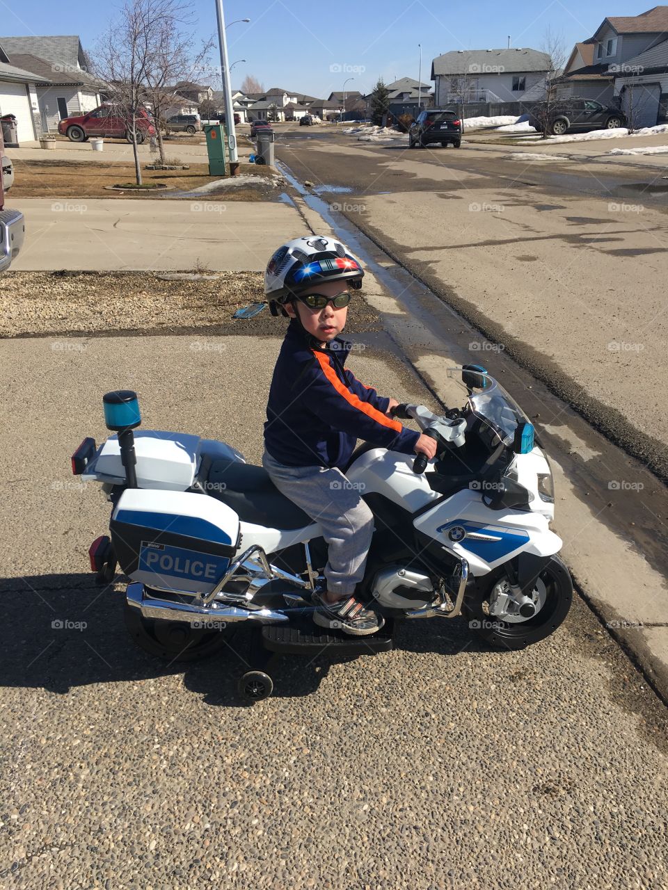 Child on a battery powered police motorcycle 
