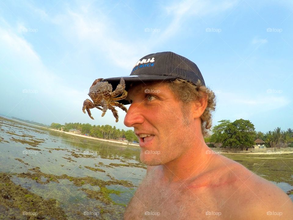 Crab on mans hat
