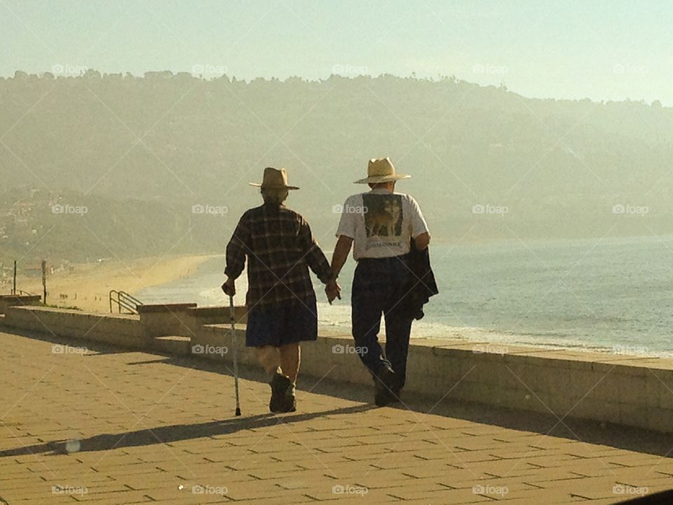 Mature couple holding hands 