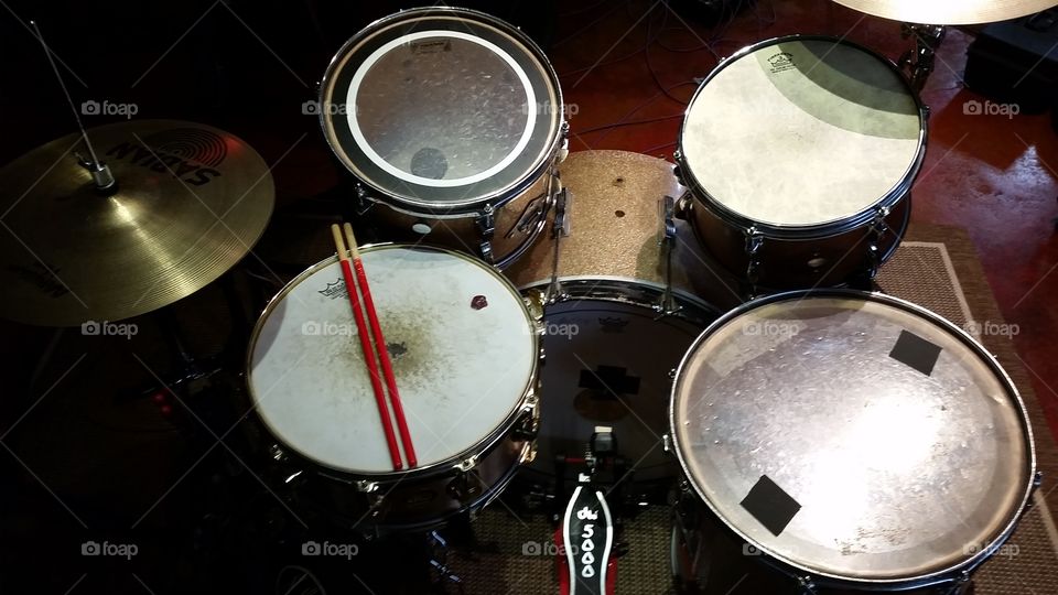 Drum set and microphones at recording studio