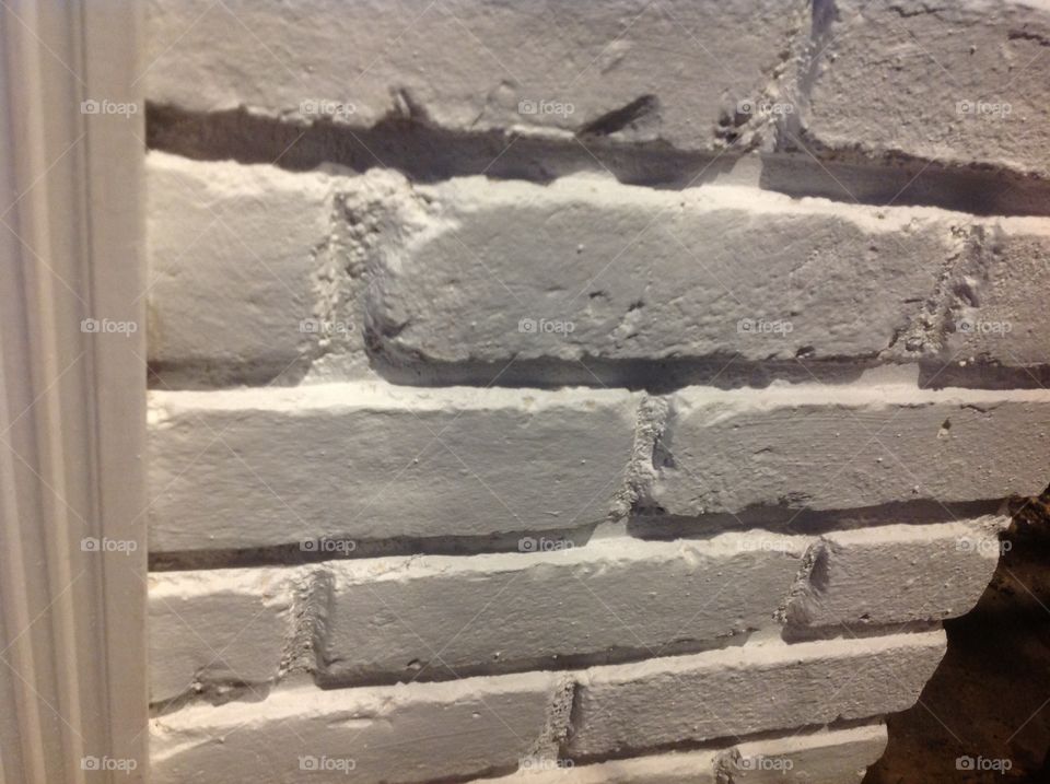 An up close photo of a white brick wall.