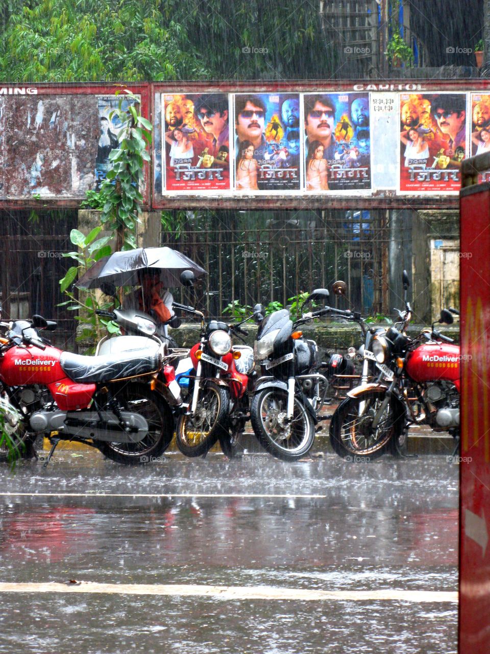 McDonald's Delivery Motorbikes in Mumbai during the monsoon season, India, Asia
