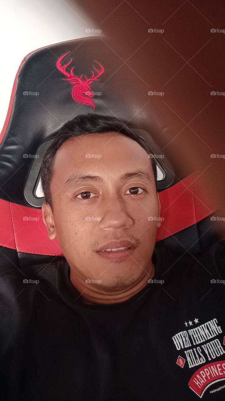 Asian man face taking selfie