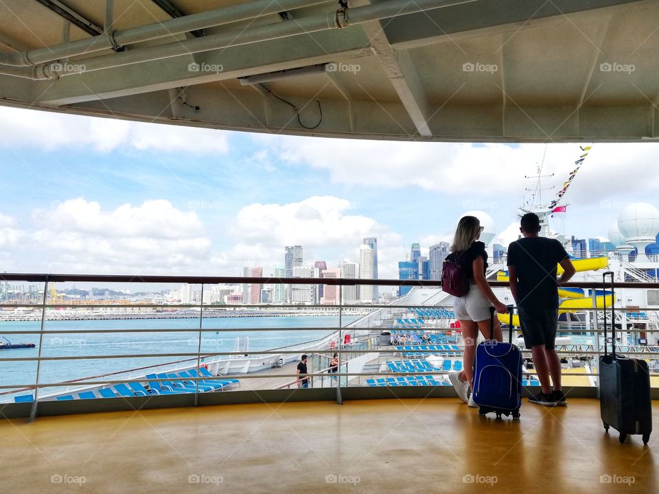 Tourists with suitcase held on cruise ship for coronavirus positivity