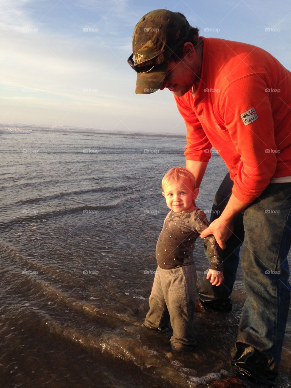 Father and son enjoying on beach