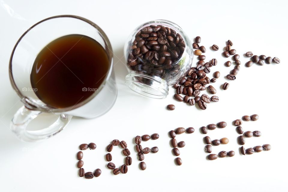 Cup of coffee with coffee beans