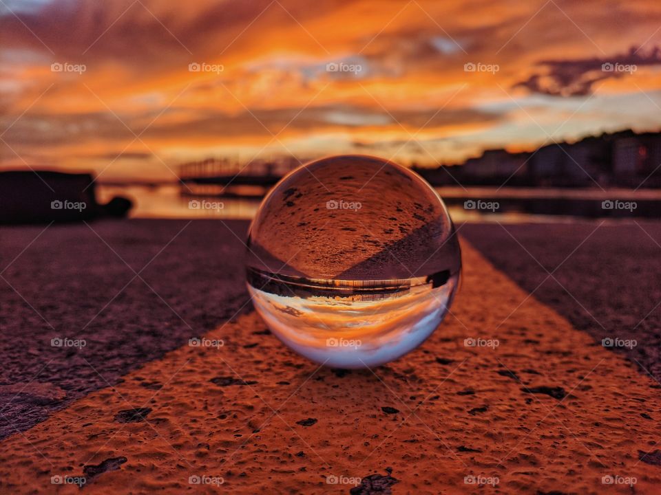 Reflection of wonderful sunset in summertime at the adriatic seaside in my lensball.