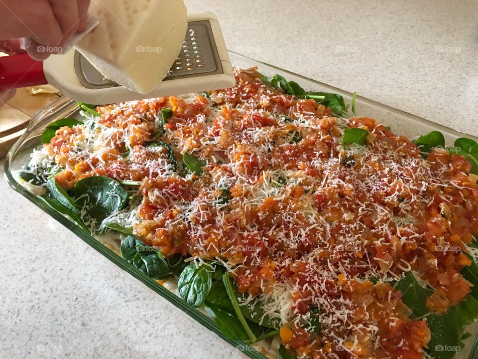 Season for baking
Layering vegetarian lasagna 