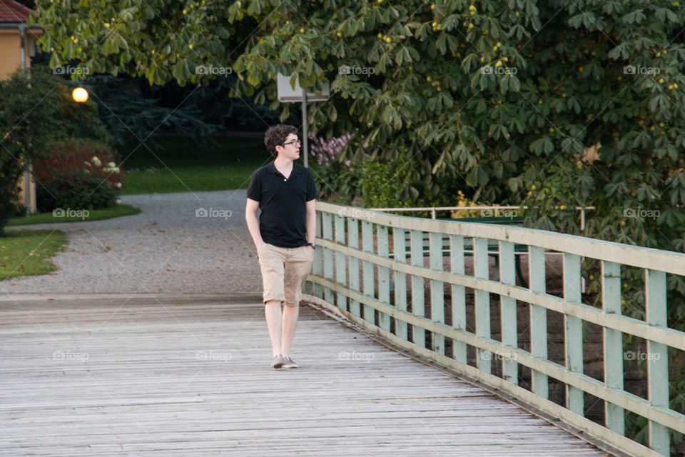 Man walking along a dock 