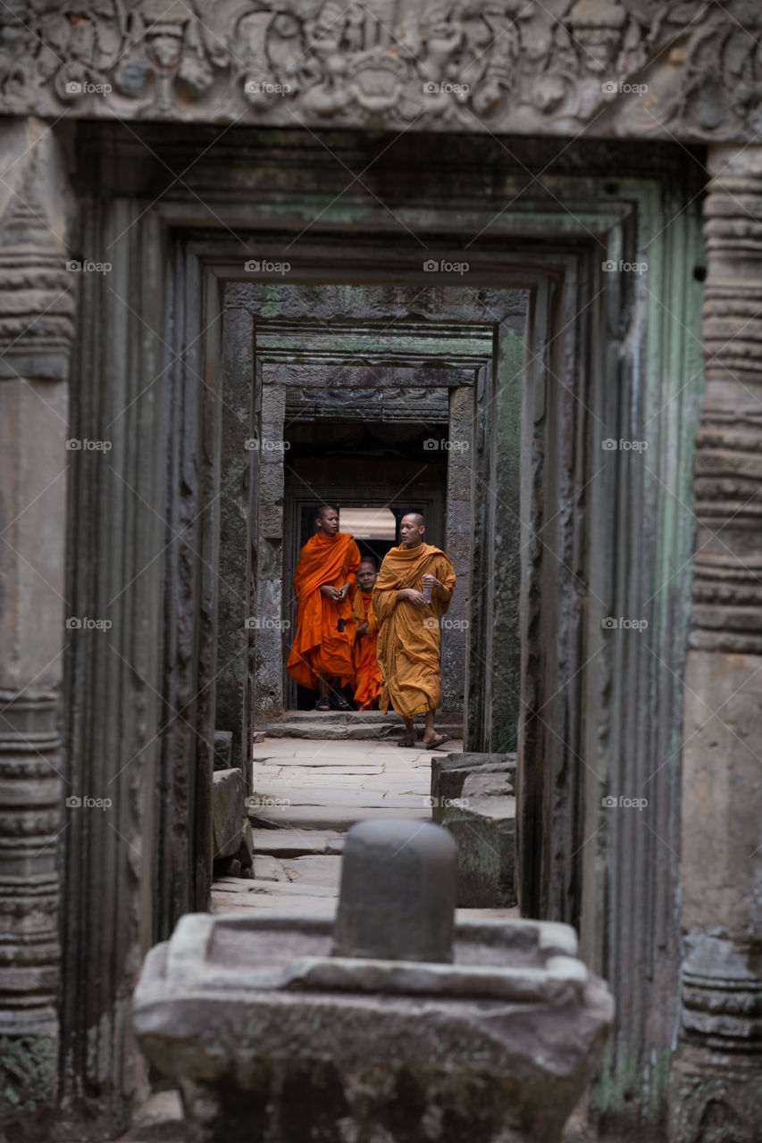 Monk explore the old temple in Cambodia