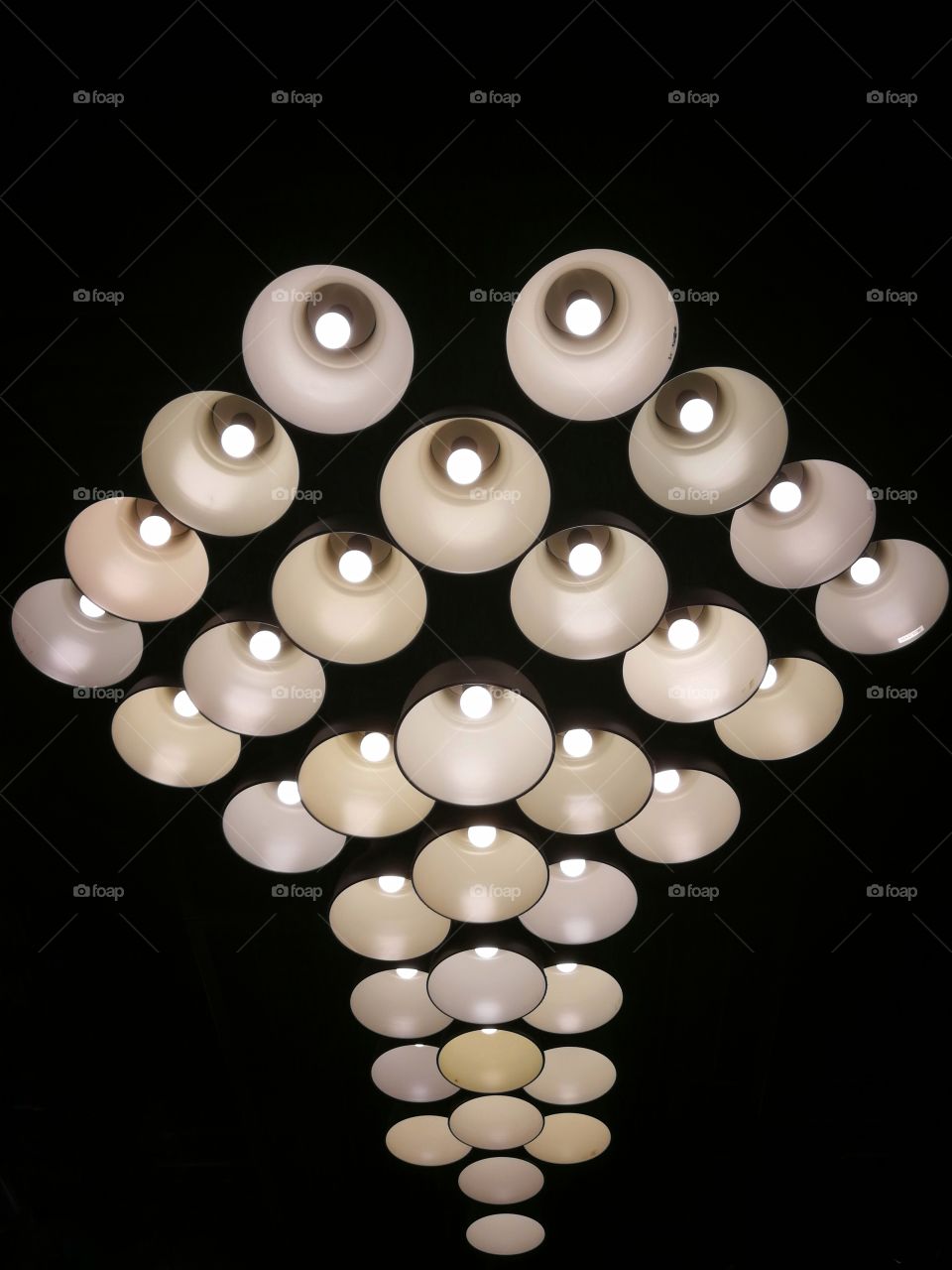 abstract group pattern of modern round lamps with black background