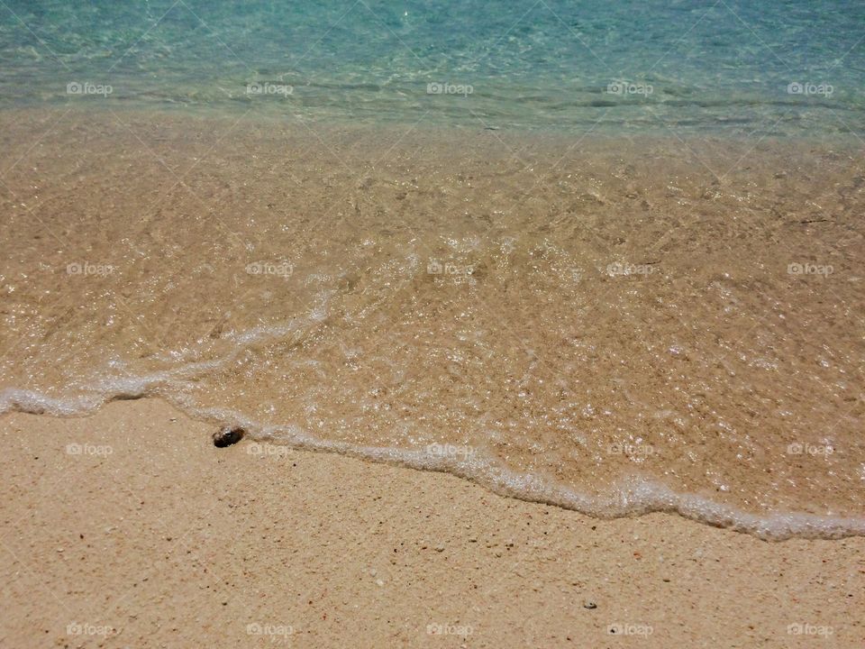 High angle view of clear-white-sand beach