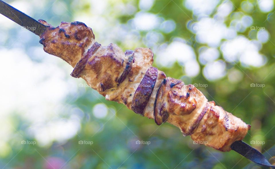 kebabs are cooked on the grill