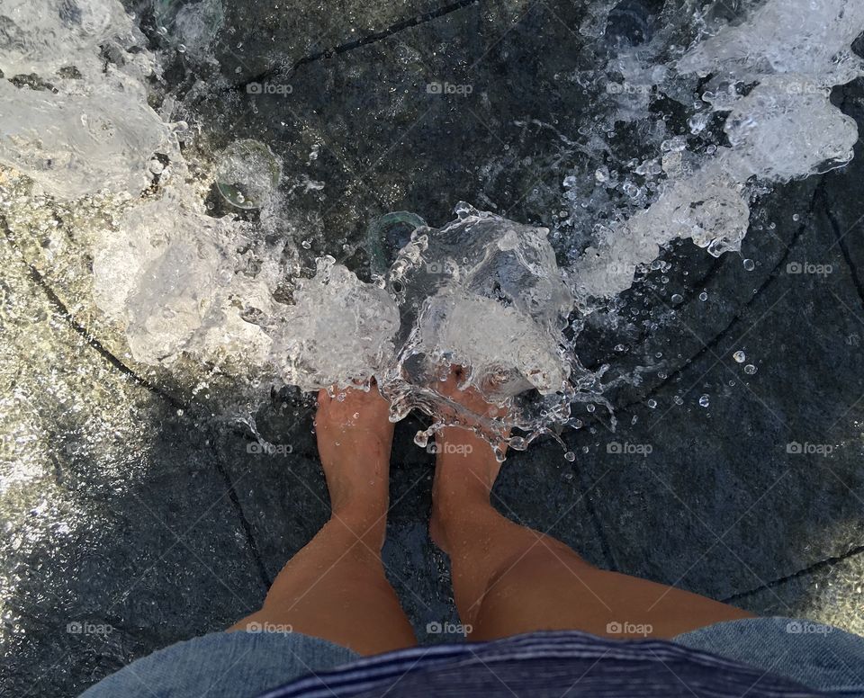 Cooling off in splash pad.