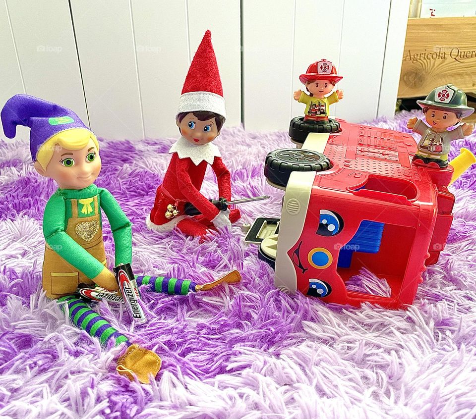 Elves fix fire truck, elf on the shelf antics, fun scenes with elf on the shelf, fixing toys for toddlers, fisher price fire truck, elves helping around the house 