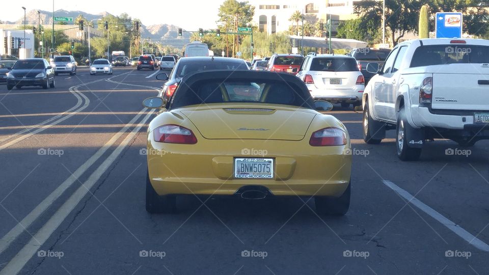 yellow Porsche Boxster yellow lines painted on Road