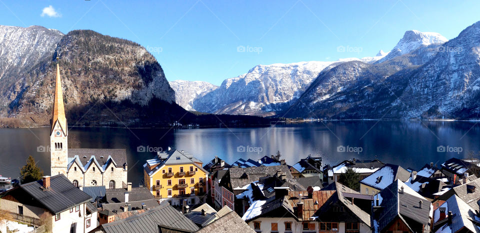 Hallstatt lake and old town city with snow mountain in winter, Austria, Europe 