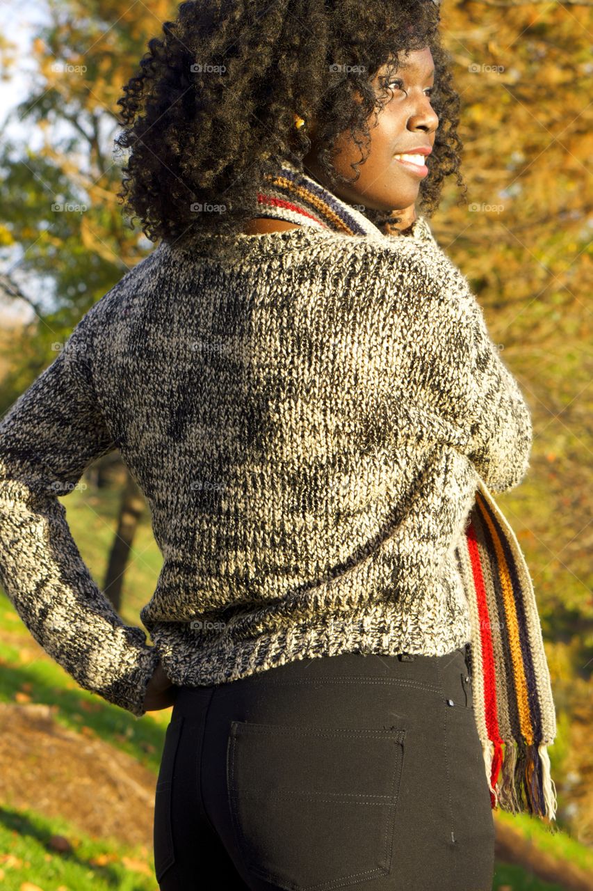 Rear view of a happy african woman