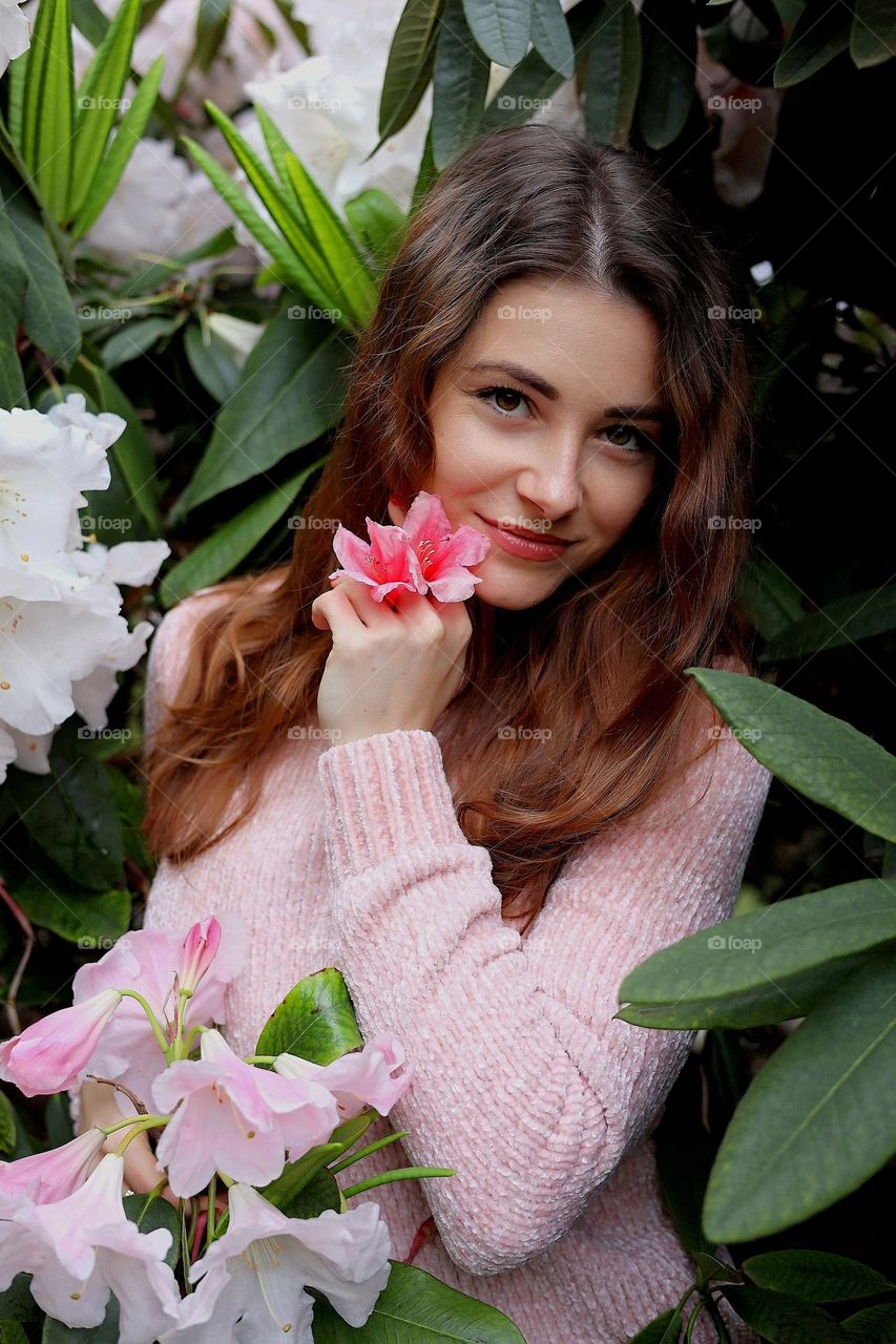 Springtime. Blooming time. Beautiful woman in the park.