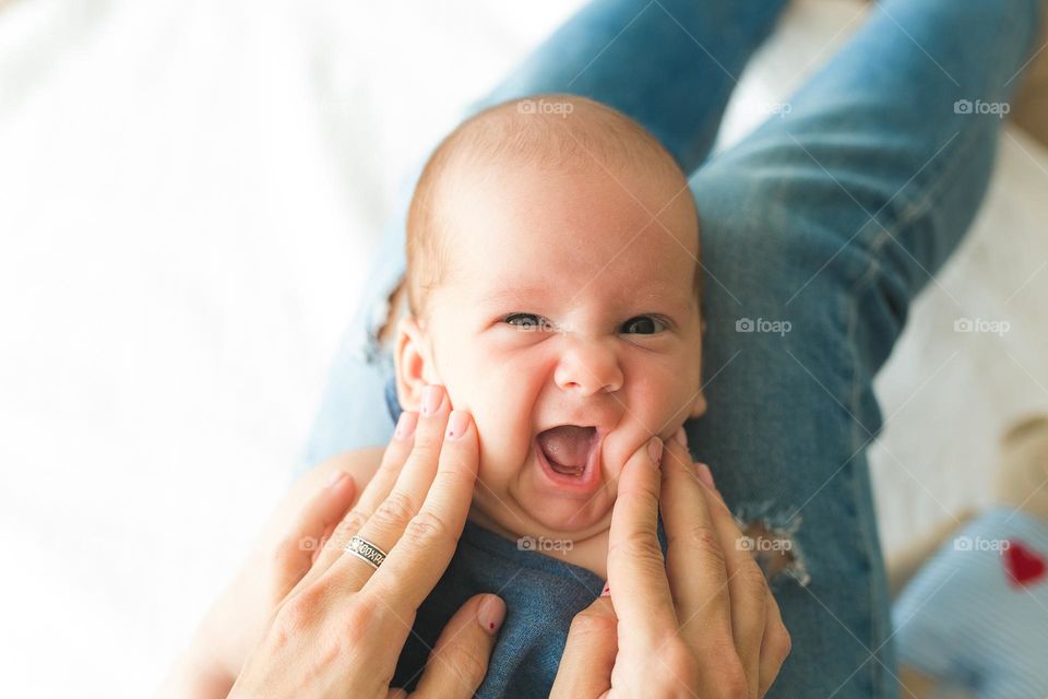beautiful mother and six-month-old son, tender family photos, family spending time at home