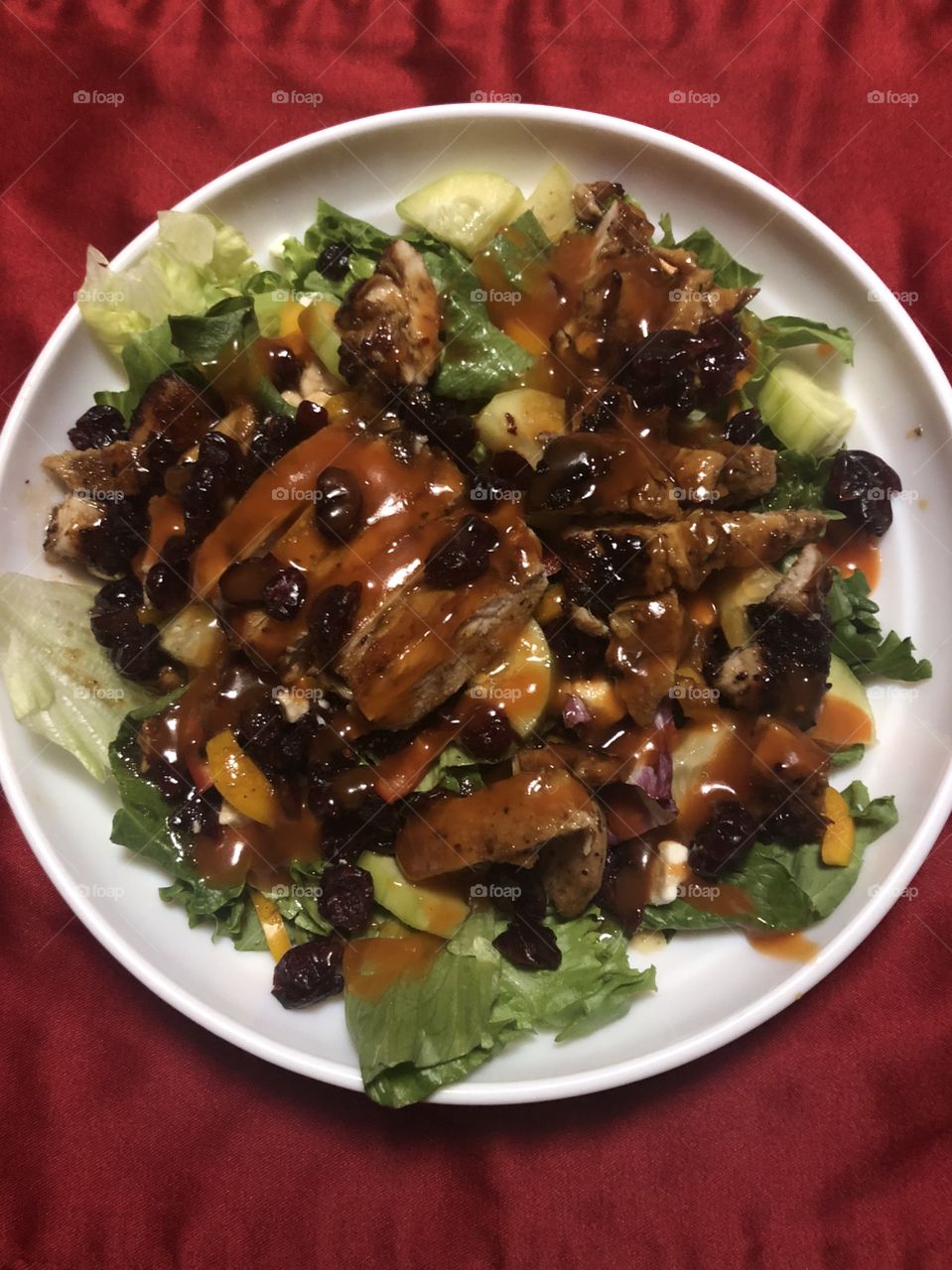 Health, mixed greens, cucumbers, sweet peppers, carrot slivers, glazed almonds, cranberries, feta cheese and grilled chicken.