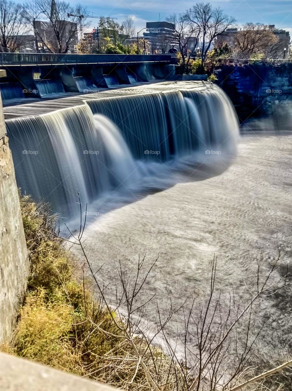 The Rideau River waterfalls on a beautiful Fall day.