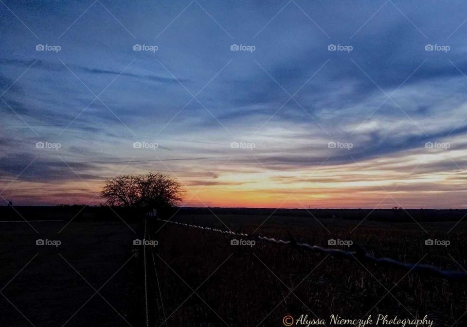 Stunning wispy clouds as sunsets for the evening. "Color Me Country".