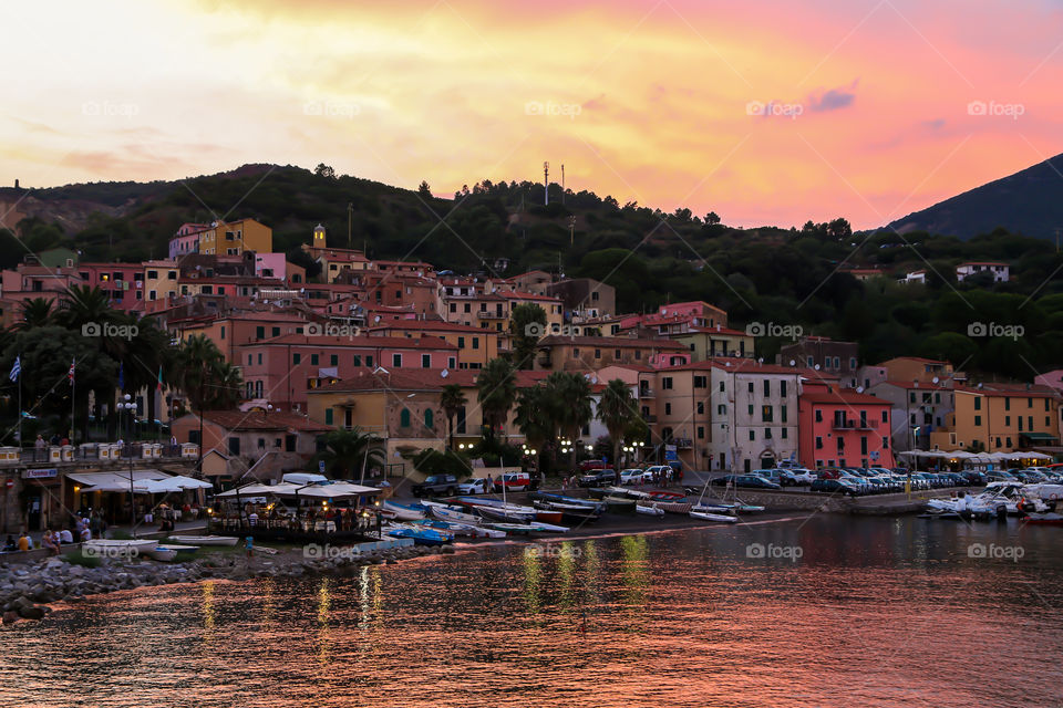 Rio Marina on fire. Amazing sunset at Elba Island