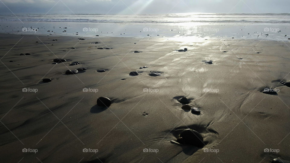 Silhouette of the rocks on the shoreline coast of California