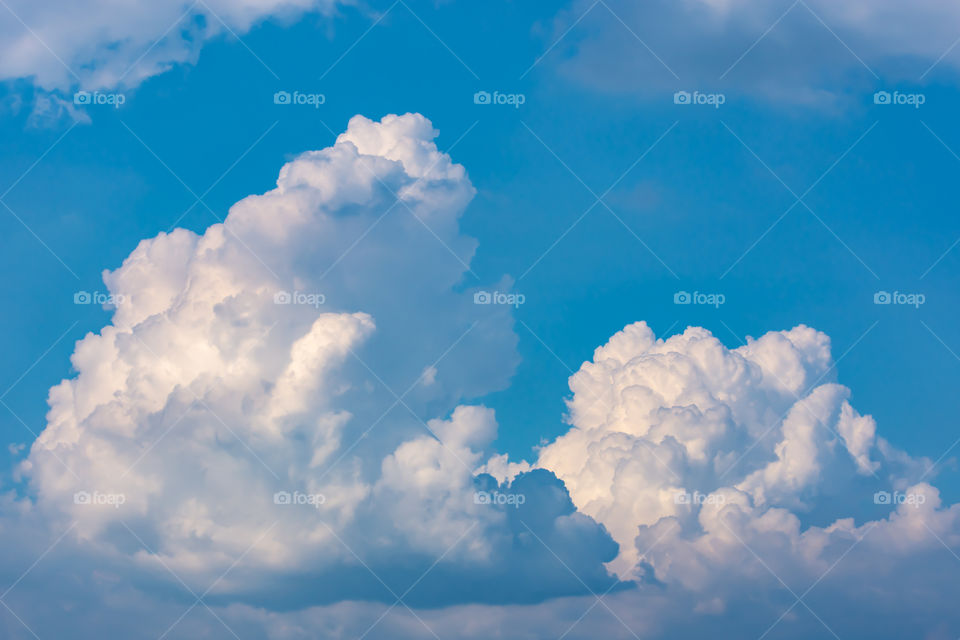 The beauty of the sky with clouds and the sun.