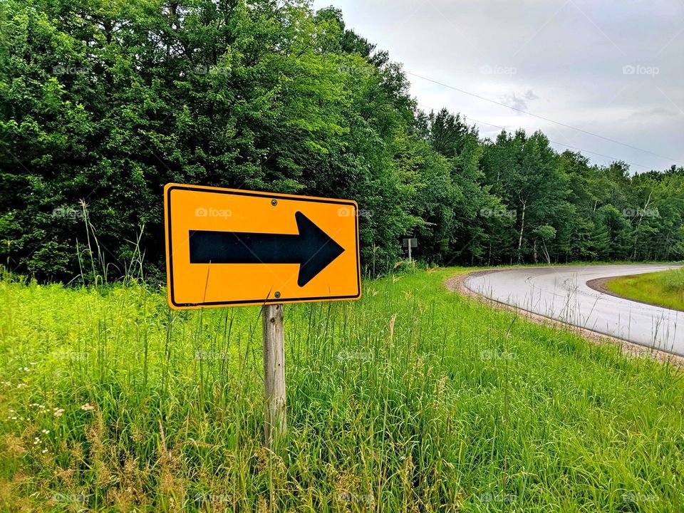 Roadsign on a curve in the country