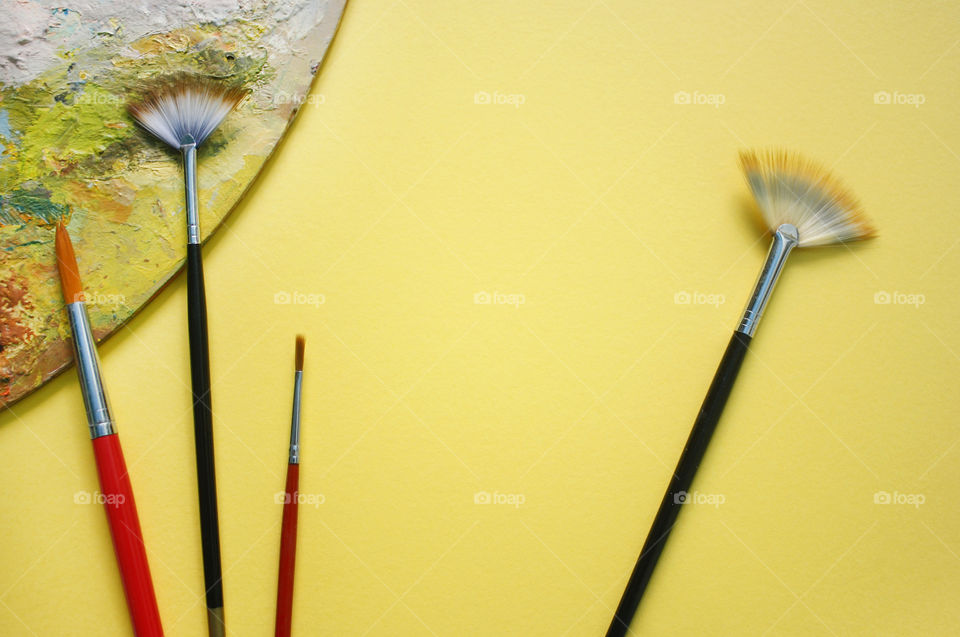 Artistic background with paintbrushes