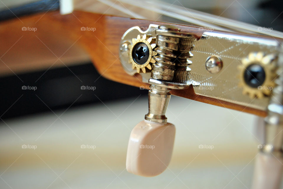 Macro shot, acoustic guitar, tuner, pegs,  closeup,