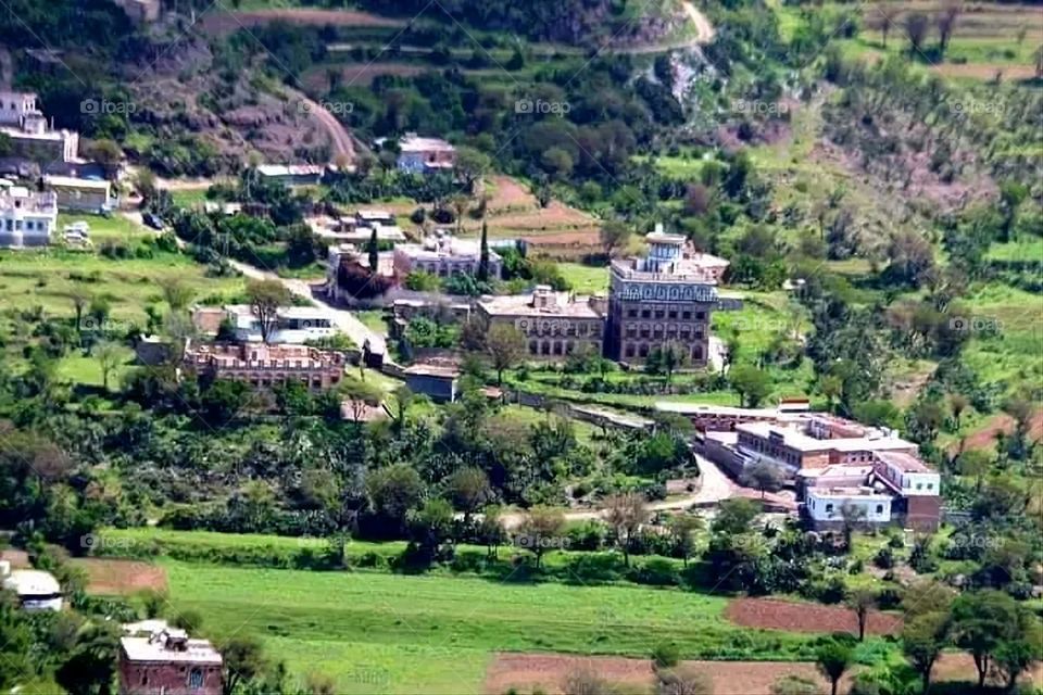 A stunning view of green mountains covered in fog in Yemen