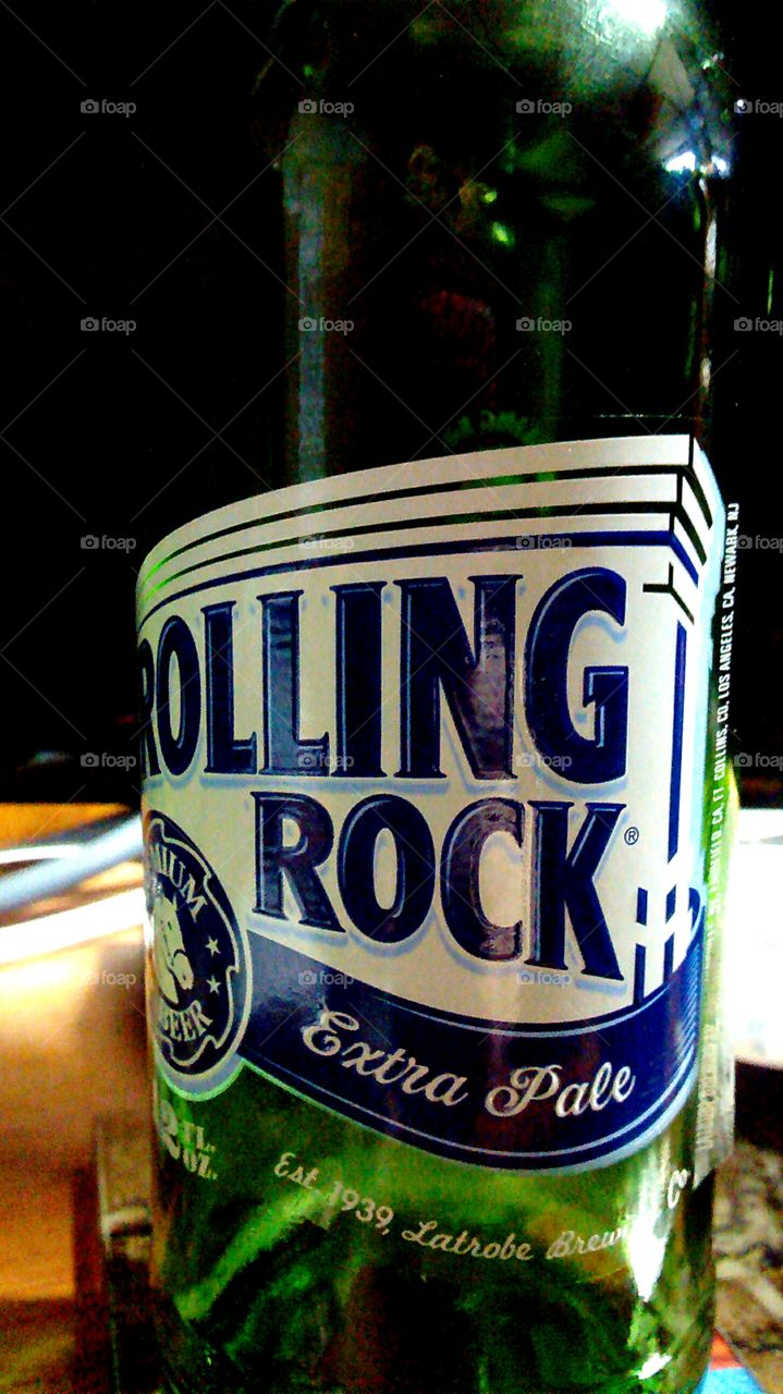 Rolling Rock Extra Pale. Closeup of Rolling Rock bottle.