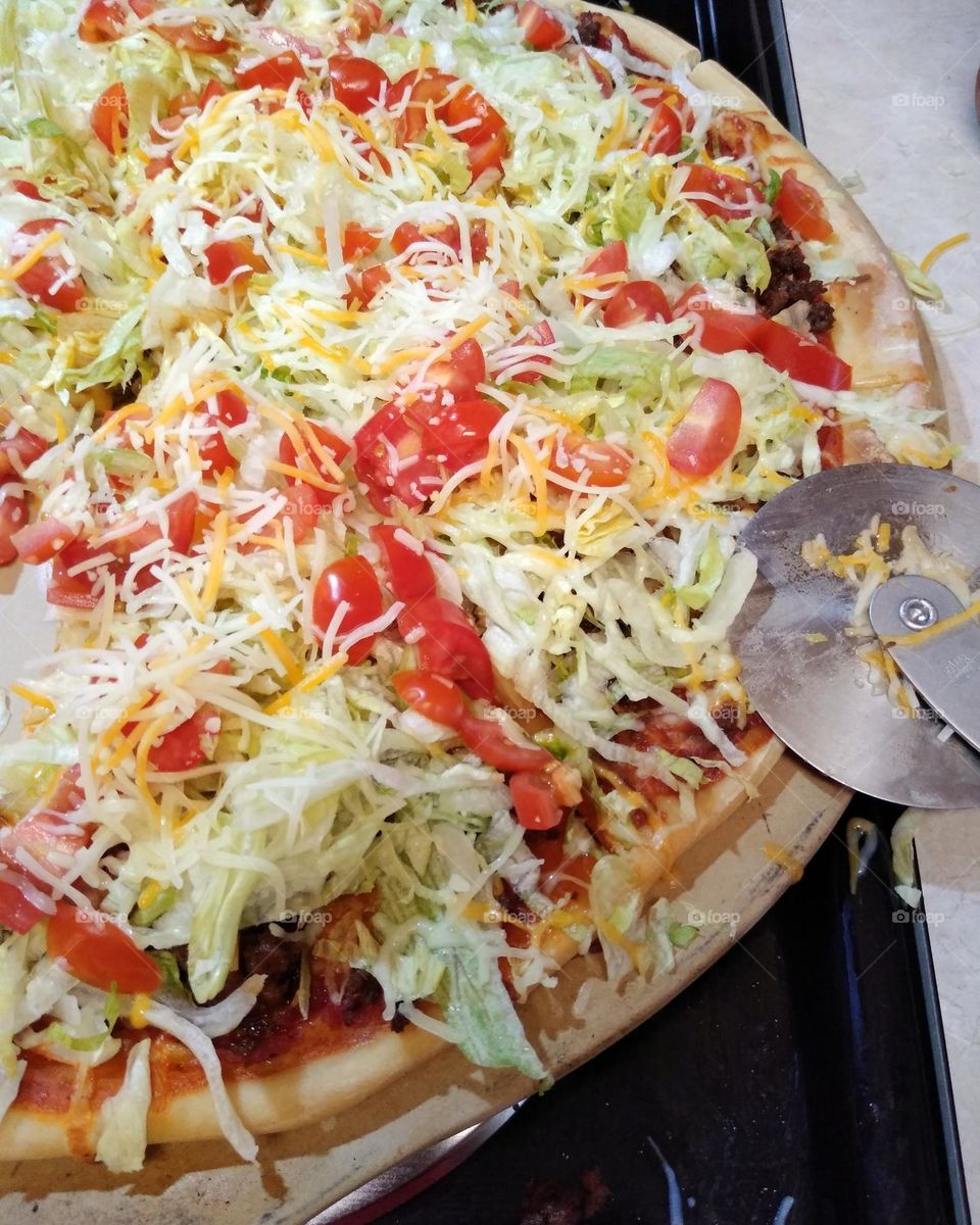 A homemade taco enchilada pizza that a friend made for her grand daughter's birthday.