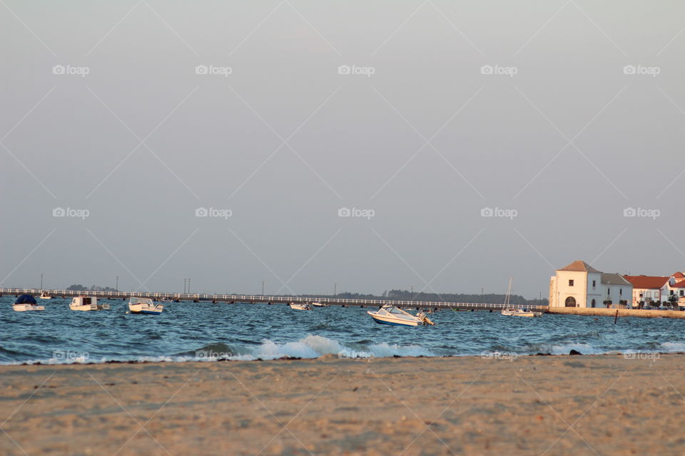 Seashore, boats at the end of the day 
